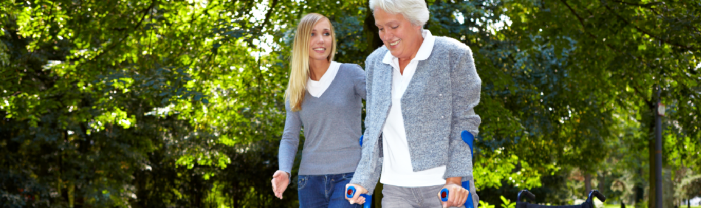 caregiver assisting patient on walking