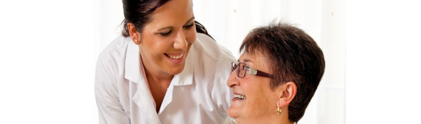 caregiver and patient smiling to each other