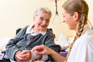 caregiver taking patient's blood pressure